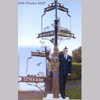 Capt Albert with the Village Sign.jpg